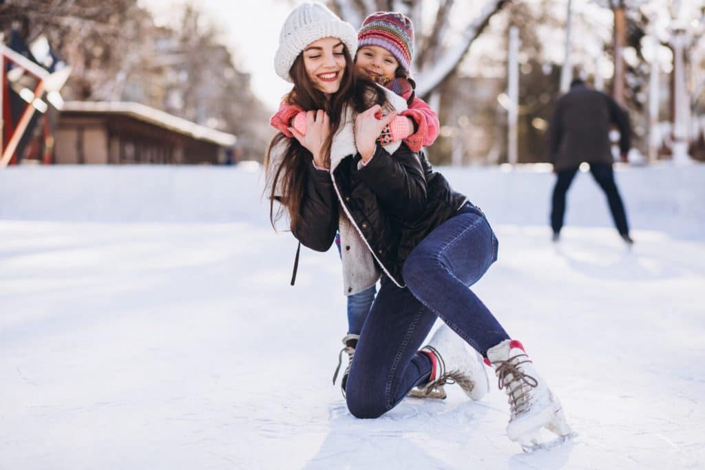 mother-with-daughter-teaching-ice-skating-rink (1)